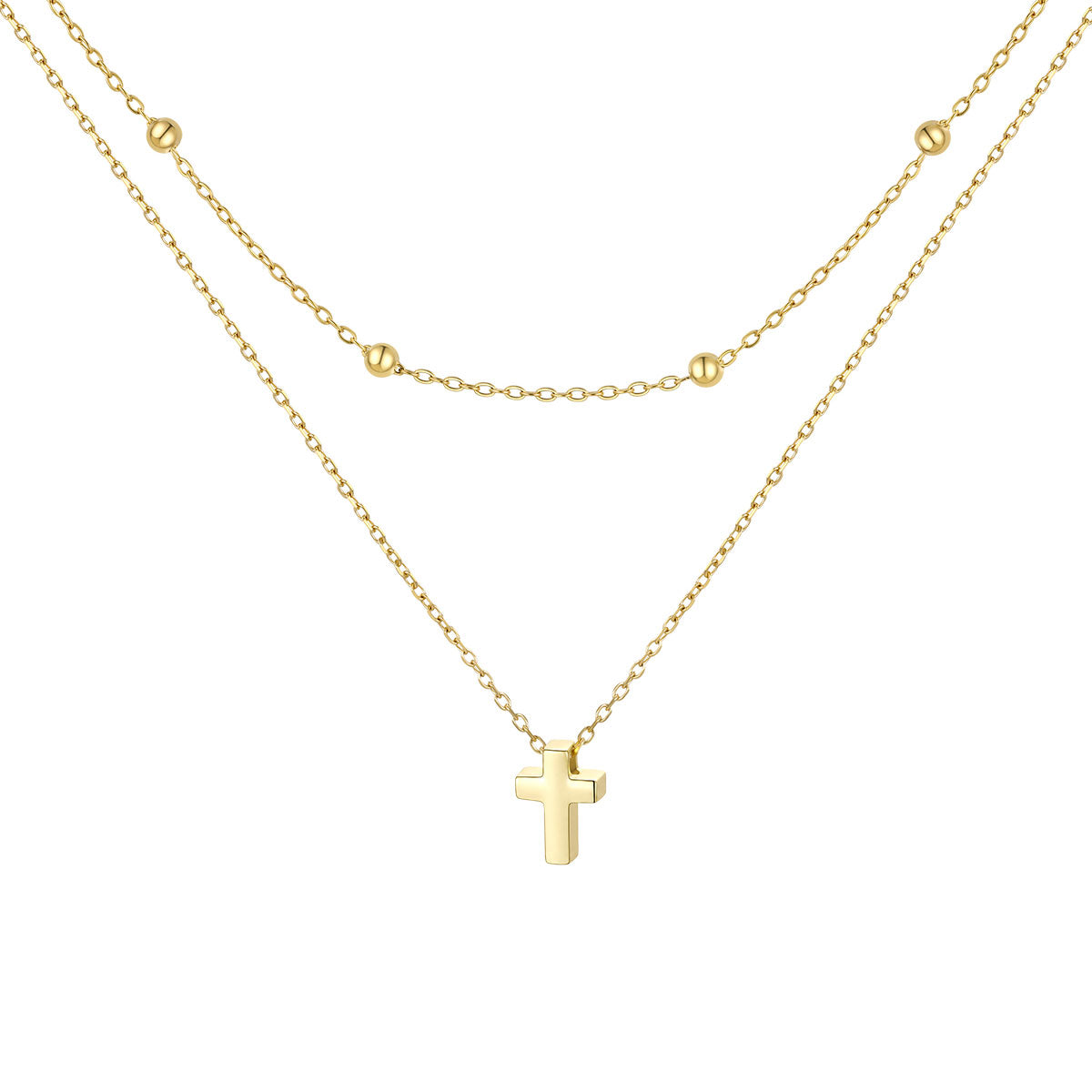 Gold cross necklace on a white background