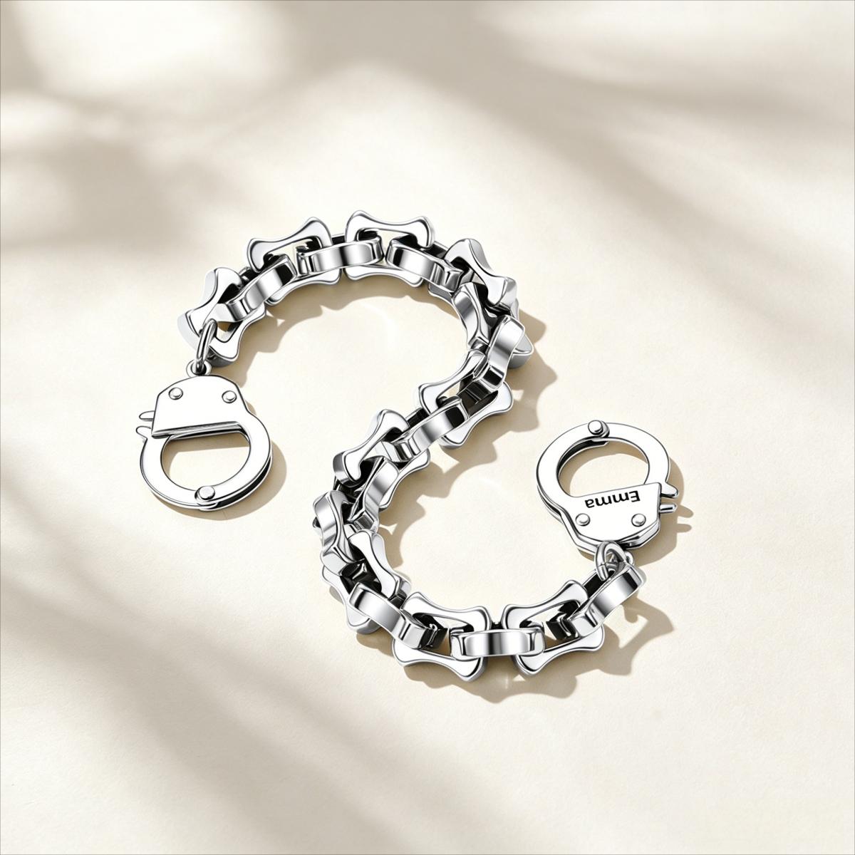 Silver bamboo link handcuff bracelet with clasp on a beige background