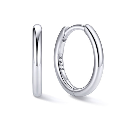 10mm Silver huggie earrings on a white background