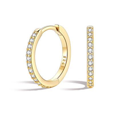12mm Gold huggie earrings with embedded cz on a white background