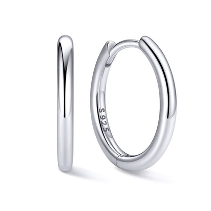 12mm Silver huggie earrings on a white background