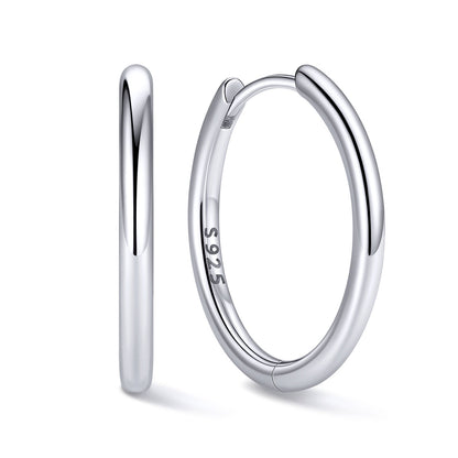16mm Silver huggie earrings on a white background