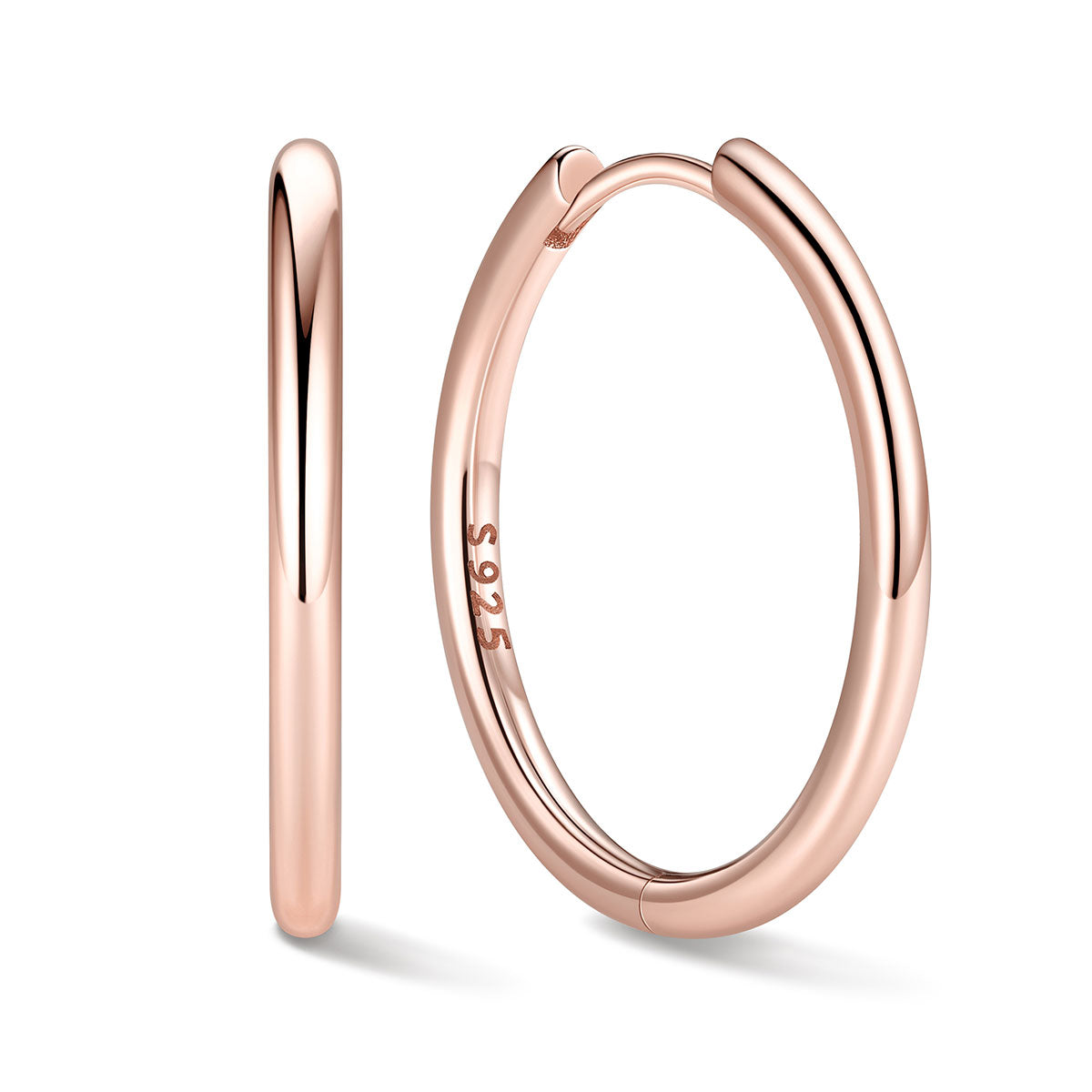 18mm Rose gold huggie earrings on a white background