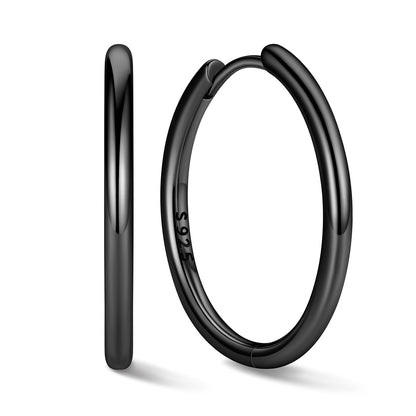 20mm Black huggie earrings on a white background
