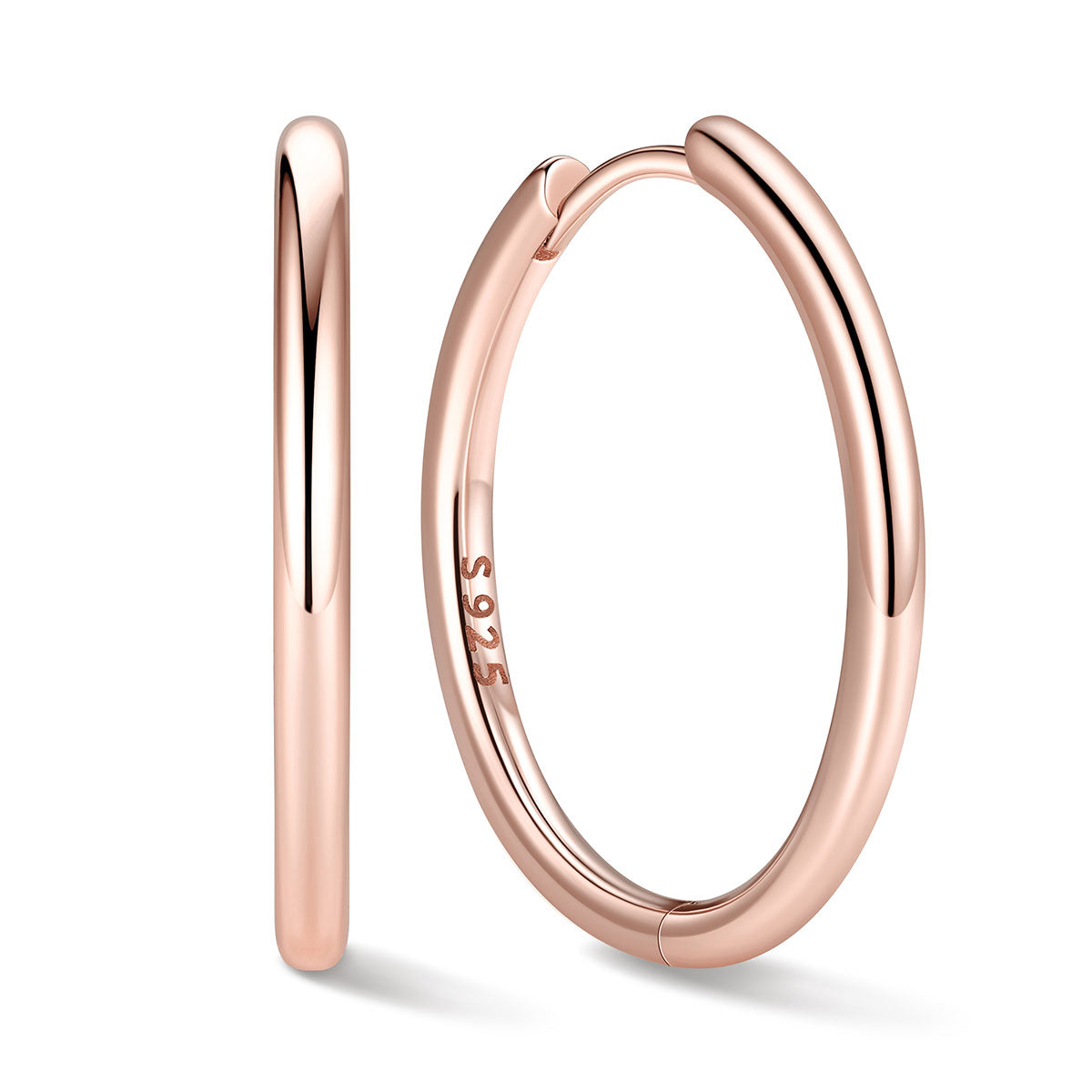 20mm Rose gold huggie earrings on a white background