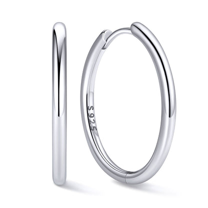 20mm Silver huggie earring on a white background