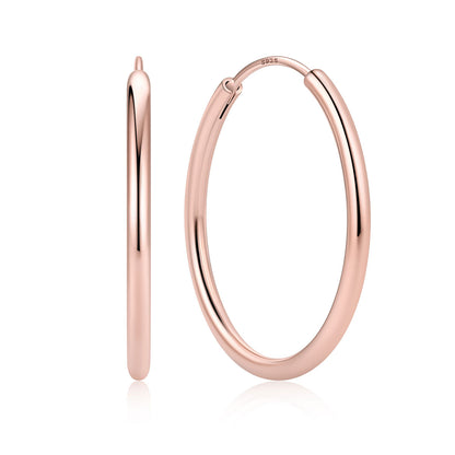 30mm Rose gold hoop earrings on a white background
