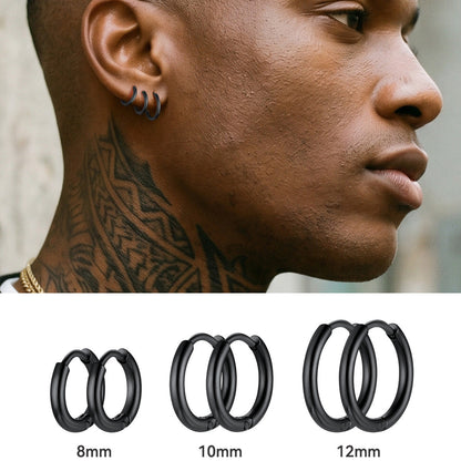 Close-up of a person with a tattooed neck and hoop earrings, with three black hoop earrings displayed below.