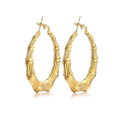 40mm Gold bamboo hoop earrings with bamboo design on a white background