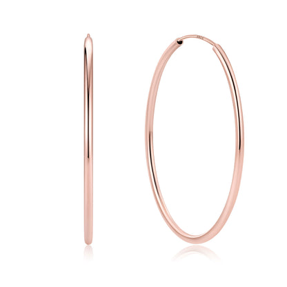 50mm Rose gold hoop earrings on a white background
