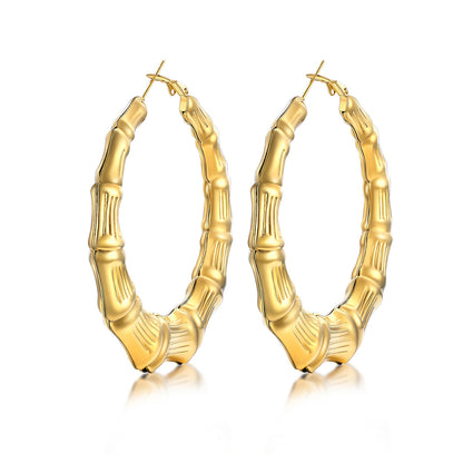 60mm Gold bamboo hoop earrings with bamboo design on a white background