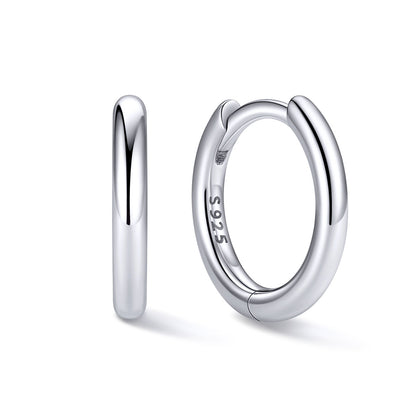 8mm Silver huggie earrings on a white background
