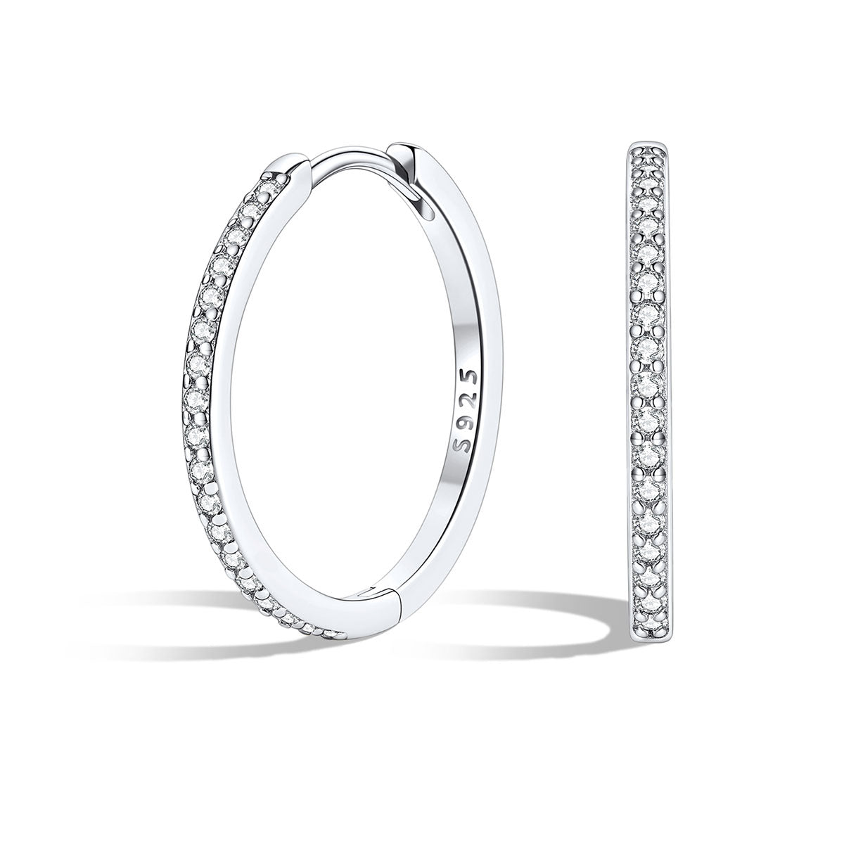 Silver huggie earrings with embedded stones on a white background