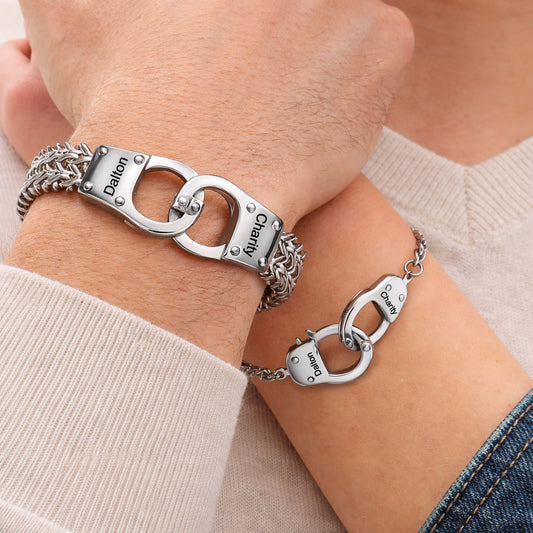 A Couple Wearing Custom Engravable Handcuff Chain Bracelet in Stainless Steel