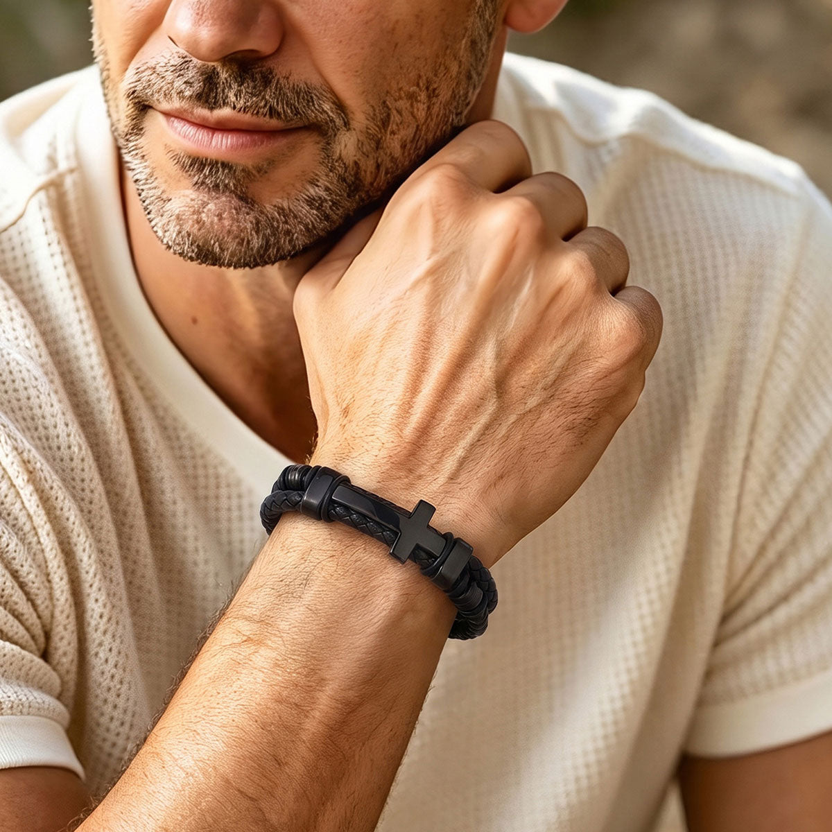A Man Wearing Black Braided Leather Bracelet with Stainless Steel Cross