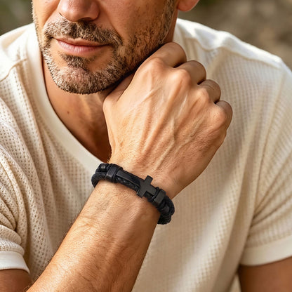 A Man Wearing Black Braided Leather Bracelet with Stainless Steel Cross