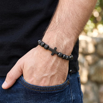A Man Wearing Black Cross Obsidian Beads Bracelet on his wrist