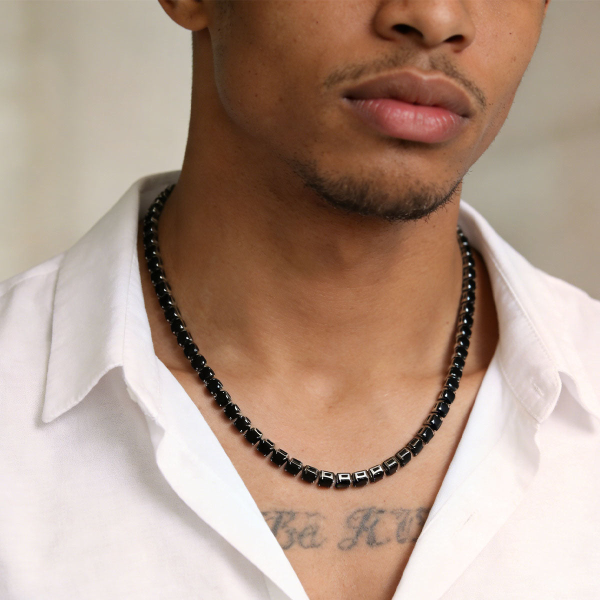A Man Wearing Black Cubic Zirconia Tennis Necklace