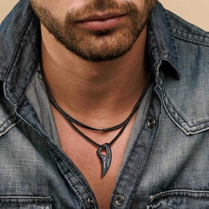 A Man Wearing Black Custom Wolf Tooth Necklace
