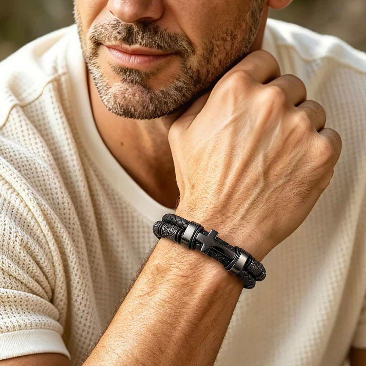 A Man Wearing Black Plated Celtic Knot Braided Leather Cross Bracelet 