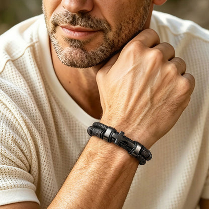 A Man Wearing Black Plated Celtic Knot Braided Leather Cross Bracelet 