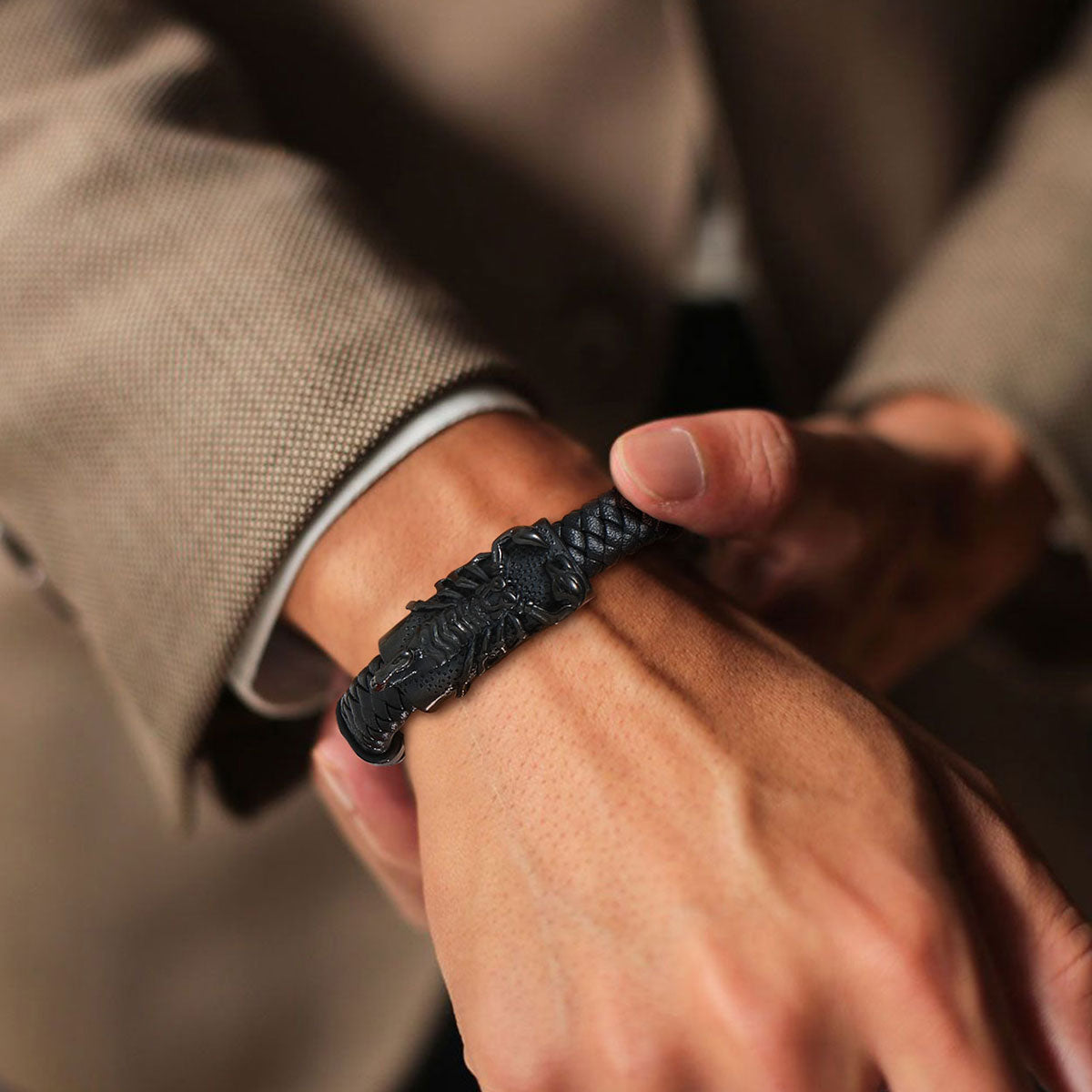 A Man Wearing Black Scorpion Leather Braided Bracelet