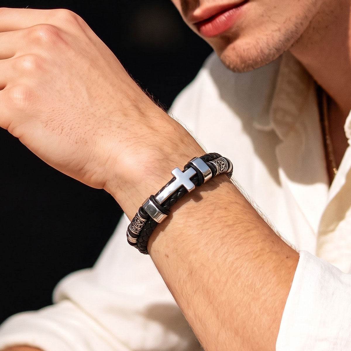 A Man Wearing Celtic Knot Braided Leather Cross Bracelet 