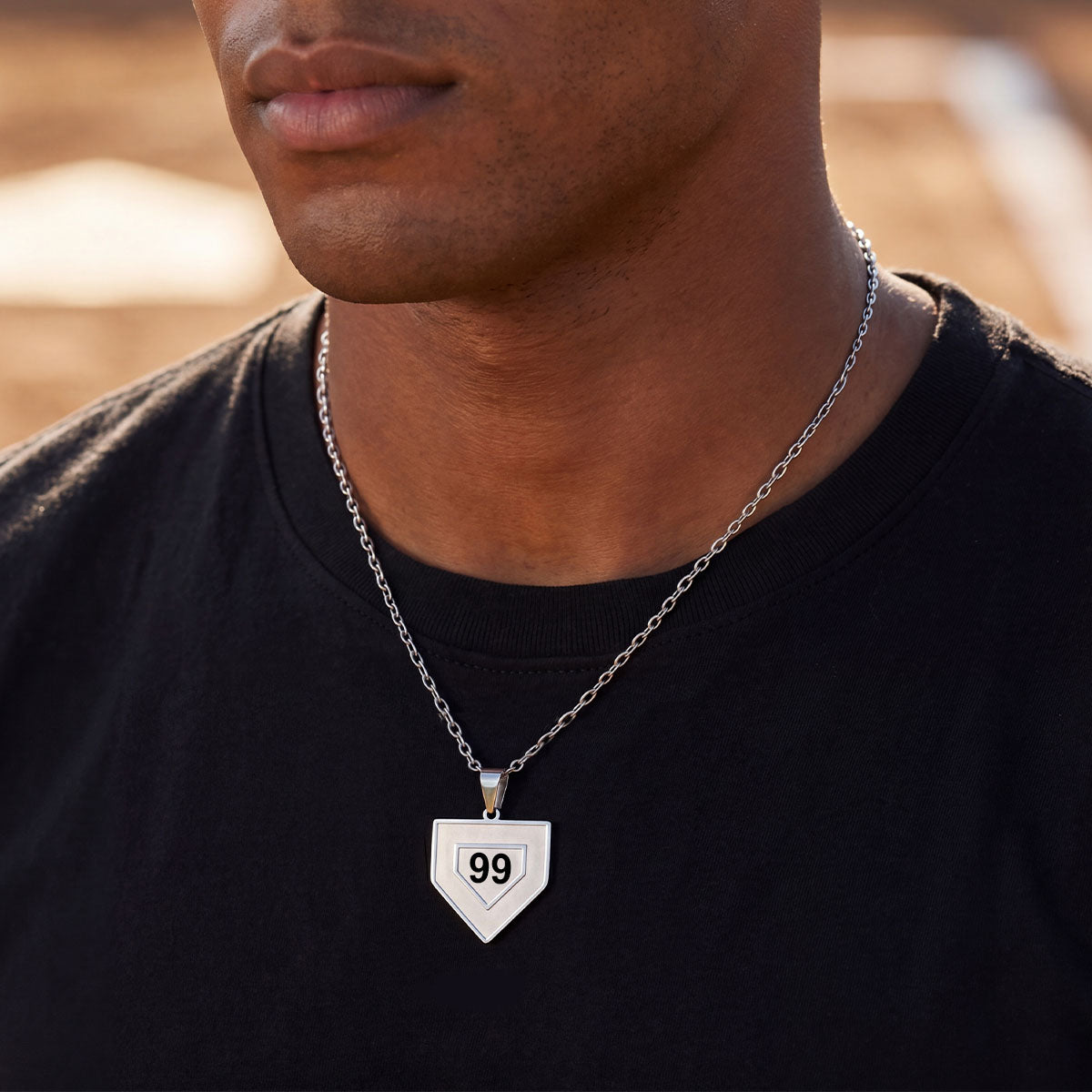 A Man Wearing Custom Baseball Home Plated Necklaces with Number