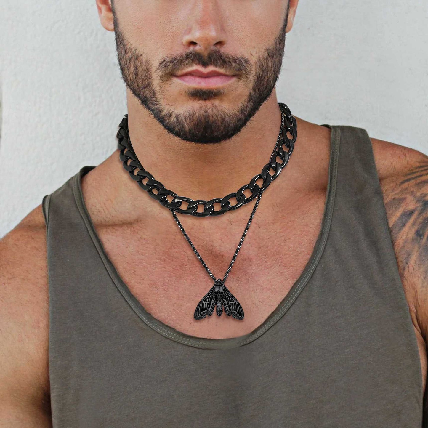 A Man Wearing Custom Death Head Moth Skull Necklace