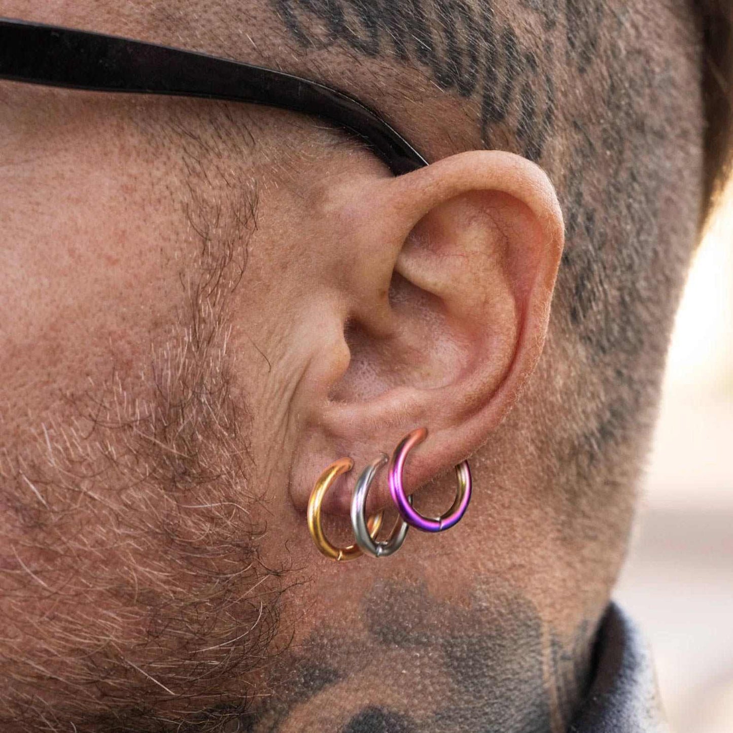 A Man Wearing Ear Cuff Clip On Hoop Earrings Set 