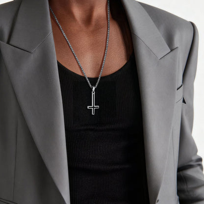 A Man Wearing Enamel Inverted Cross Necklace