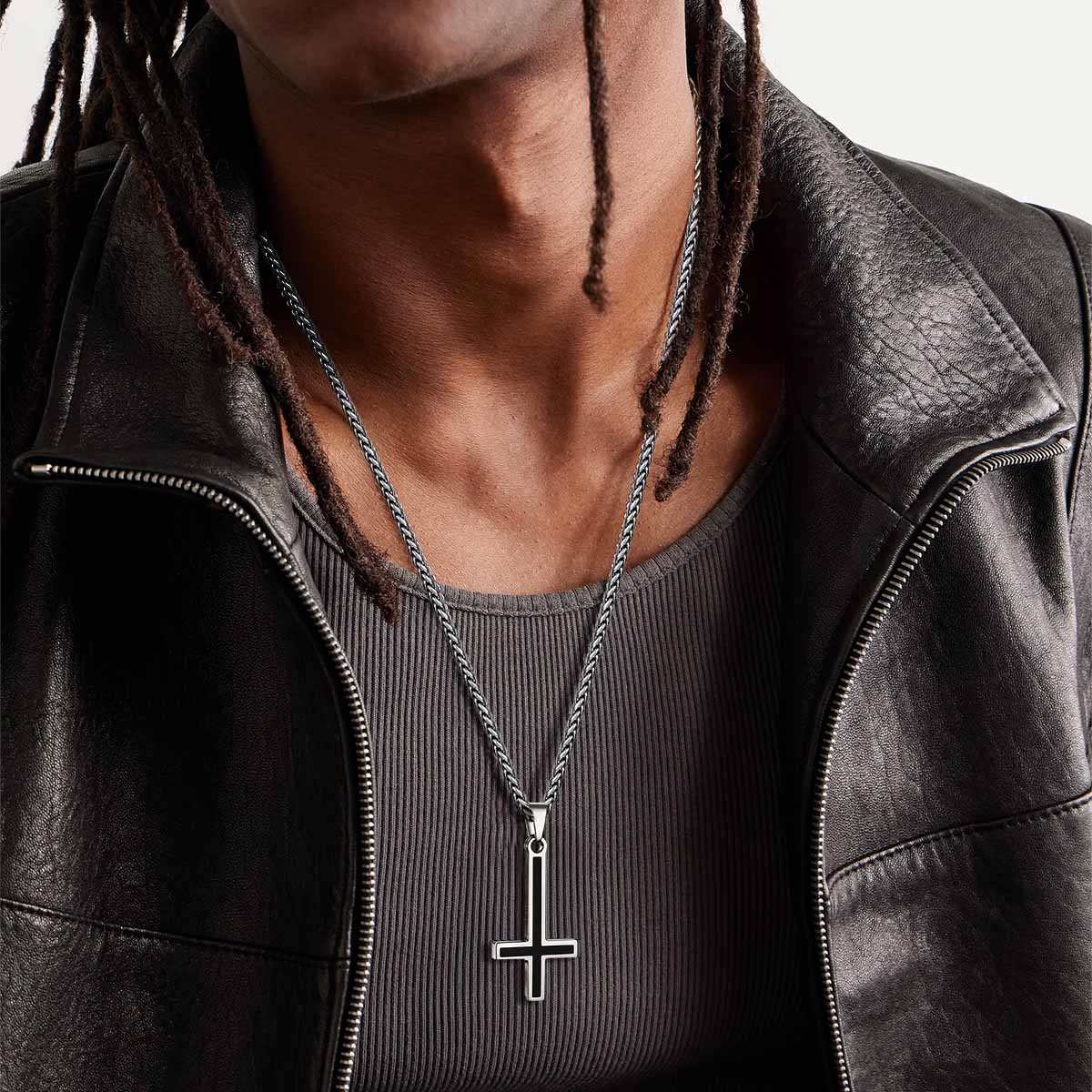 A Man Wearing Engraved Enamel Inverted Cross Necklace