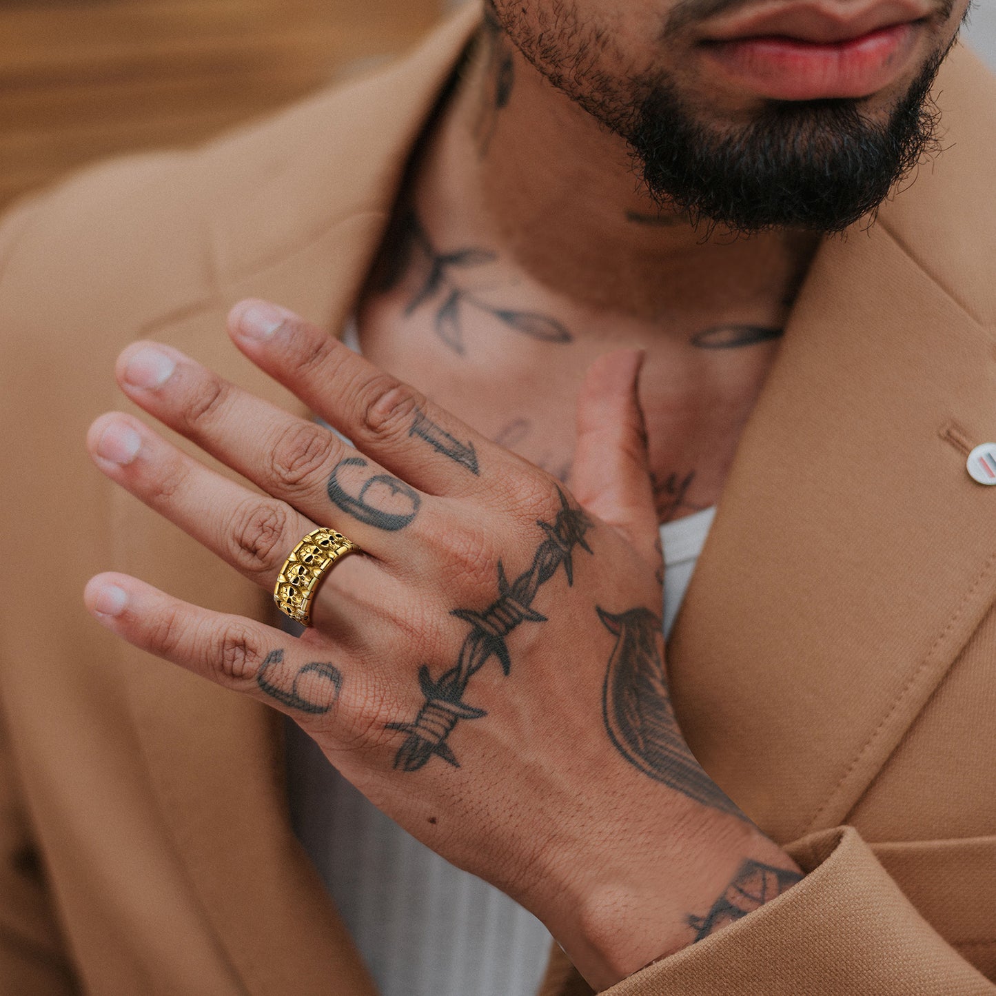 A Man Wearing Engraved Gothic Skull Ring in Gold Plated