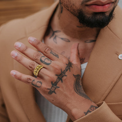A Man Wearing Engraved Gothic Skull Ring in Gold Plated