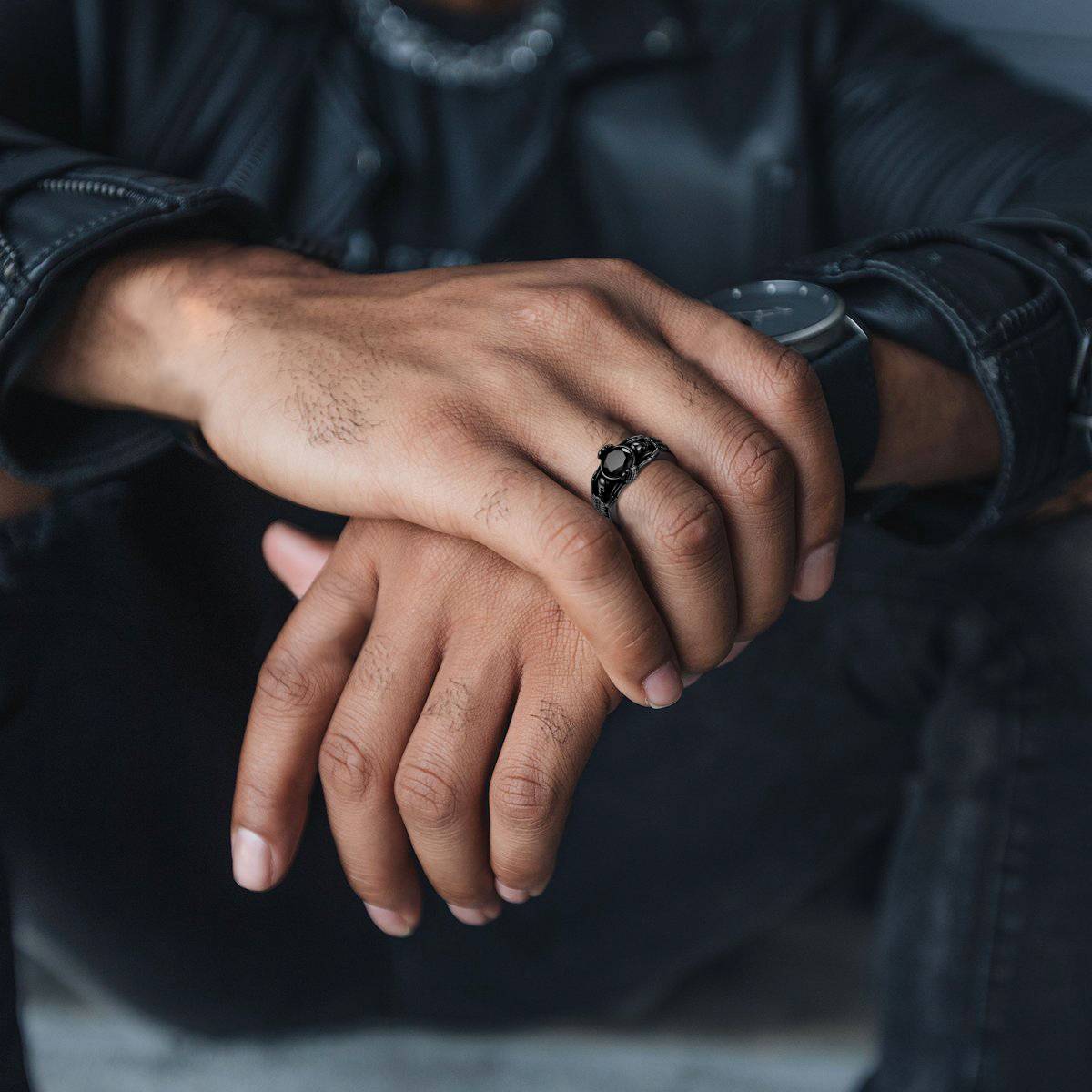 A Man Wearing Engraving Black Onyx Skull Band Ring