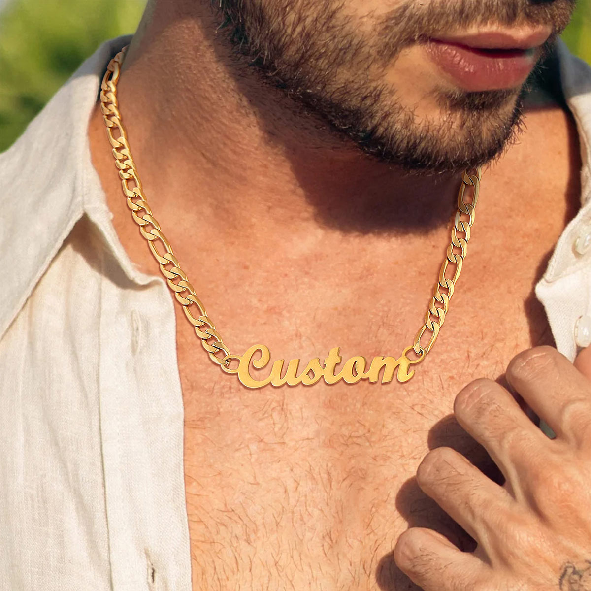 A Man Wearing Figaro Chain Necklace\