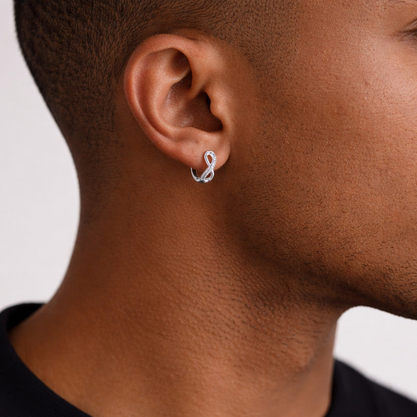 A Man Wearing Infinity Earrings Huggie Hoop Earrings in 925 Sterling Silver