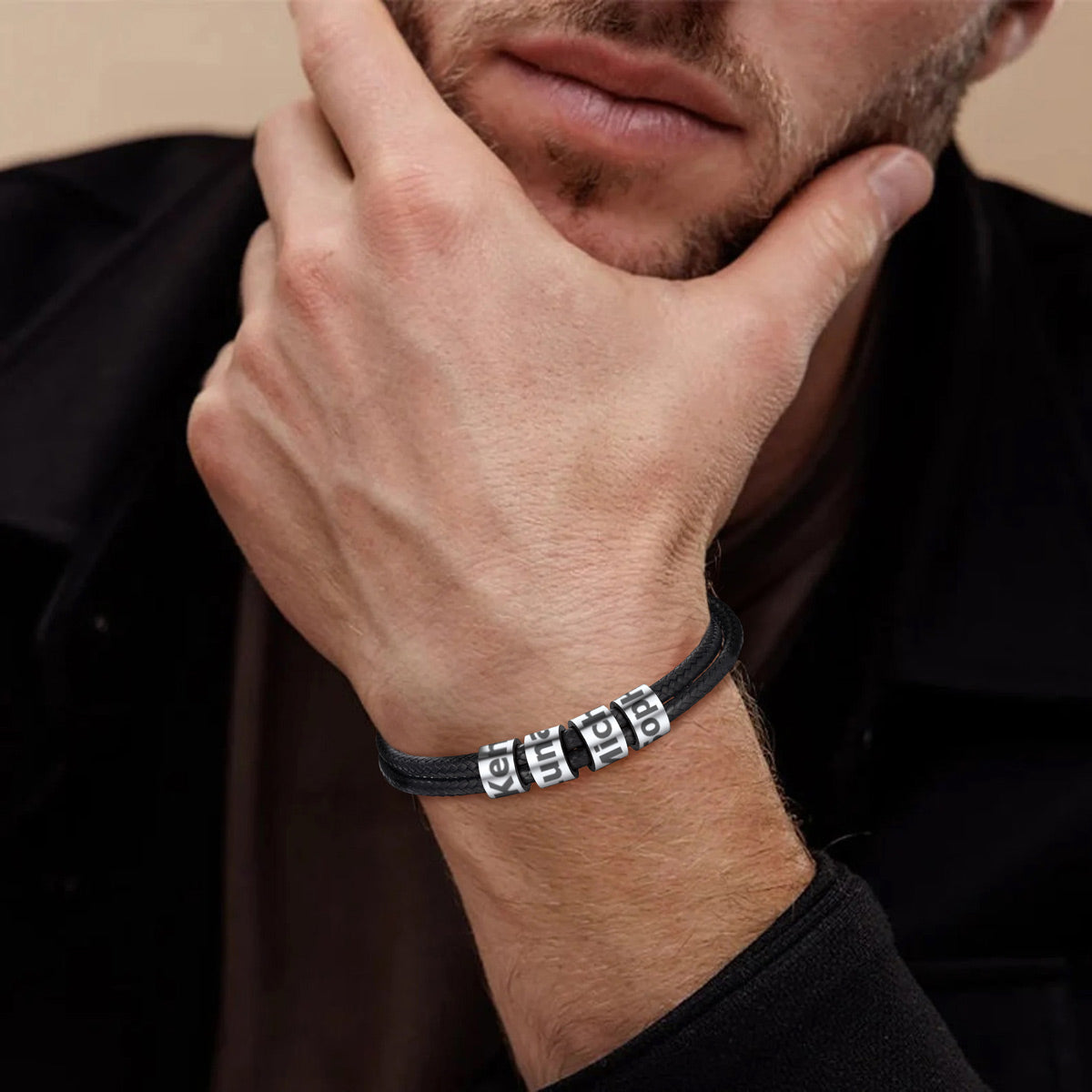 A Man Wearing Leather Braided Rope Bracelet with Engraving Beads