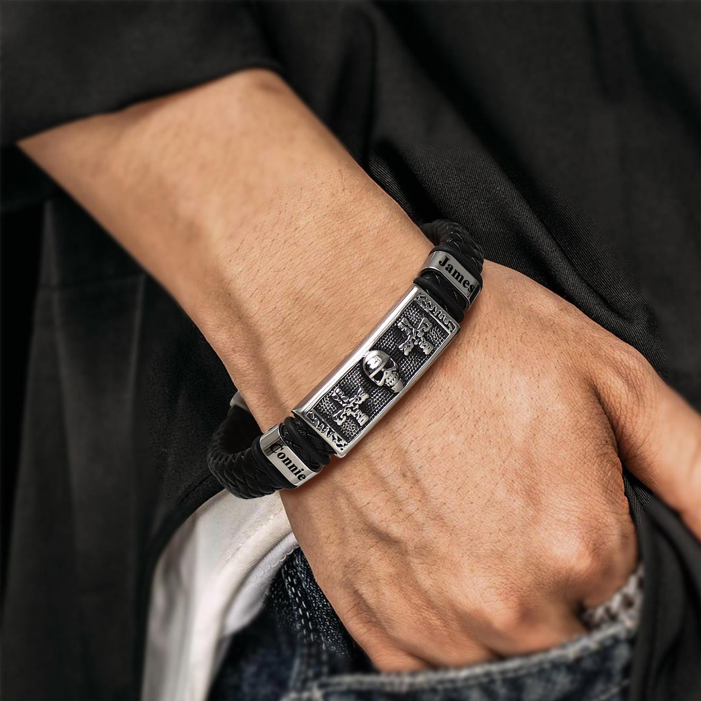 A Man Wearing Leather Skull Bracelet