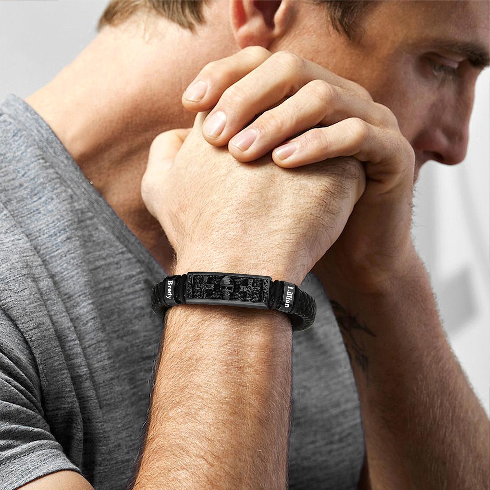 A Man Wearing Leather Skull Cross Bracelet