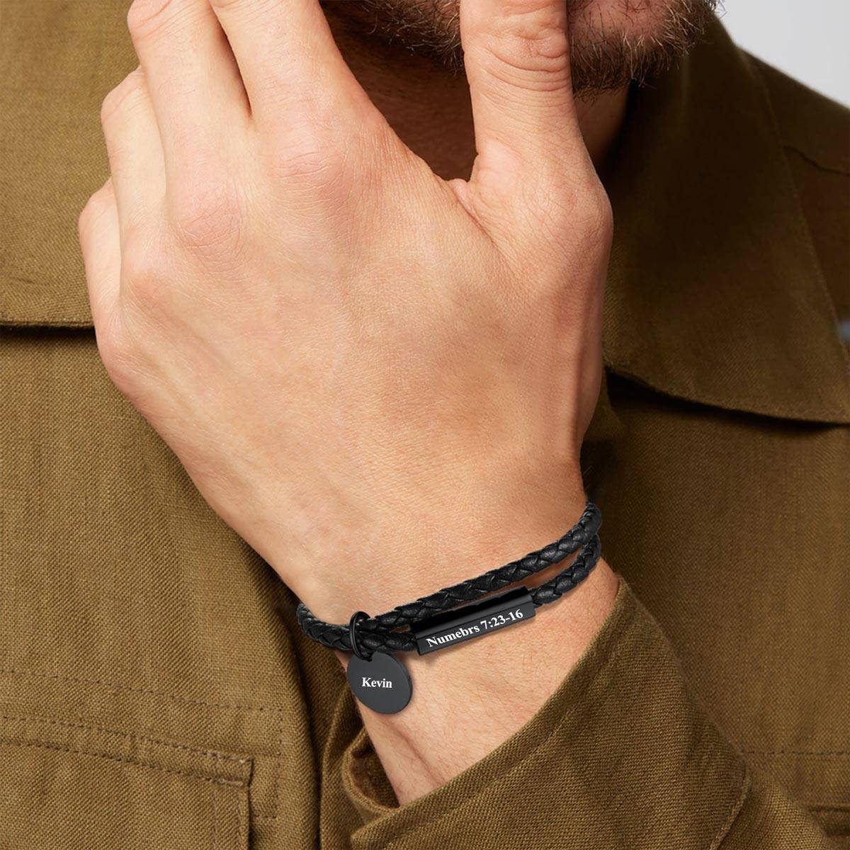 A Man Wearing Name Plate Leather Bracelet 