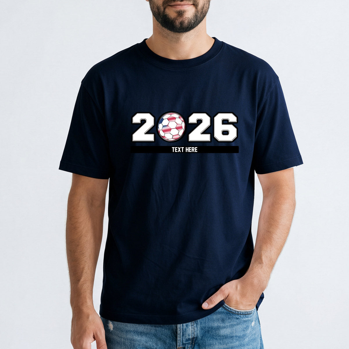 A Man Wearing Navy blue world cup t-shirt with '2026' text and soccer ball design on a plain background