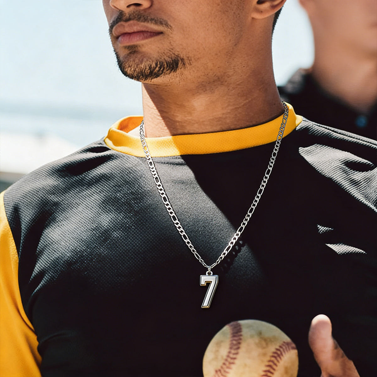 A Man Wearing Number Figaro Chain Necklaces for Men