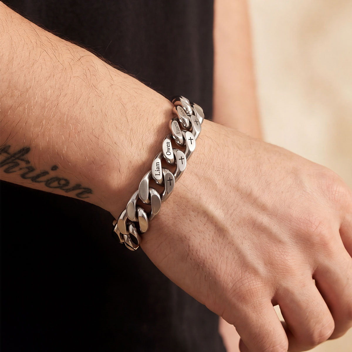 A Man Wearing Personalized 1-8 Multi Names Cuban Link Bracelet with Cross