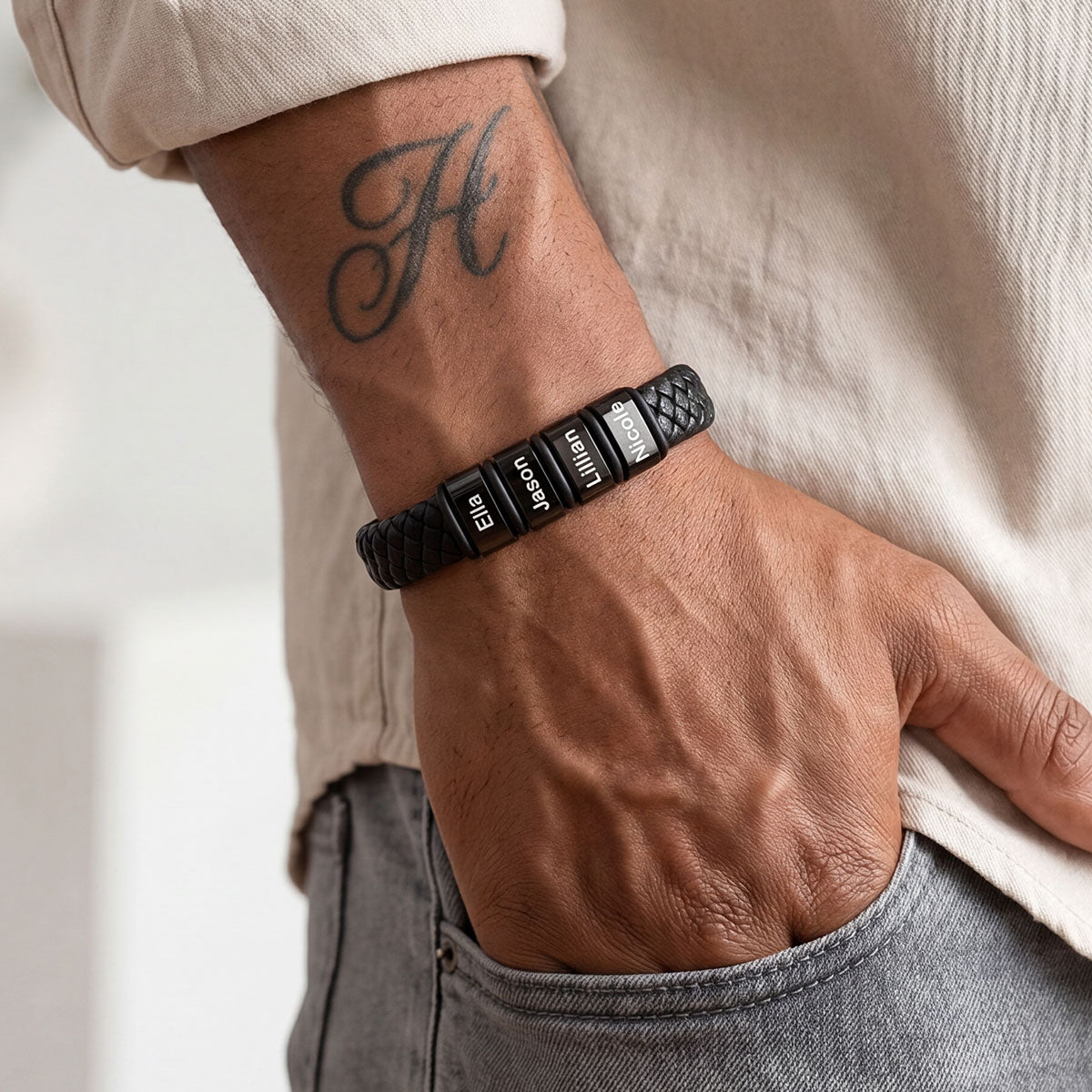 A Man Wearing Personalized Leather Braided Bracelet with Engraving Beads
