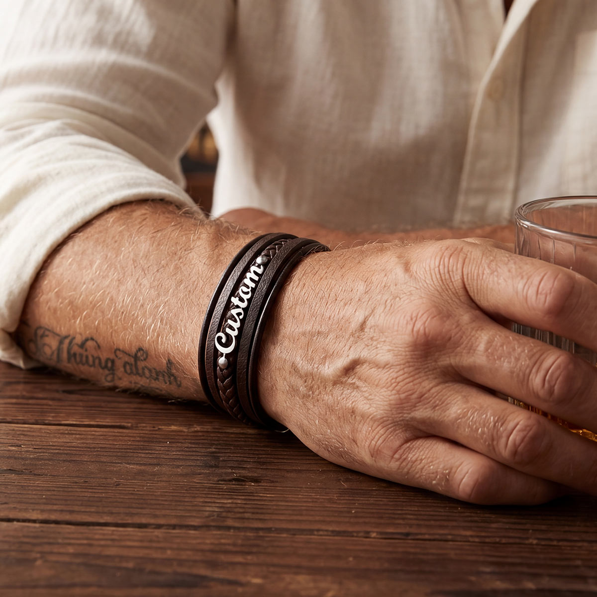 A Man Wearing Personliazed Name Braided Leather Bracelet