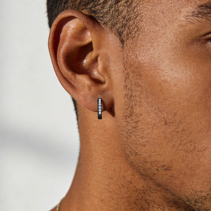 A Man Wearing Silver Cubic Zirconia Huggie Hoop Earrings