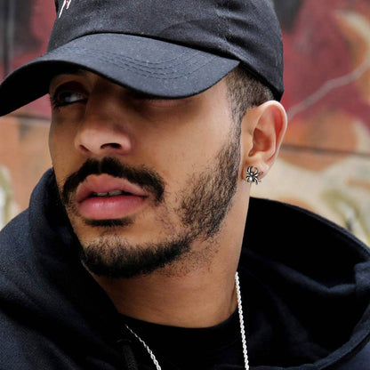 A Man Wearing Stainless Steel Spider Stud Earrings