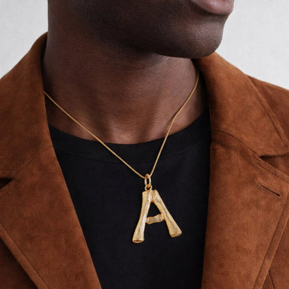 A Man Wearing Statement Bamboo Initial Necklace