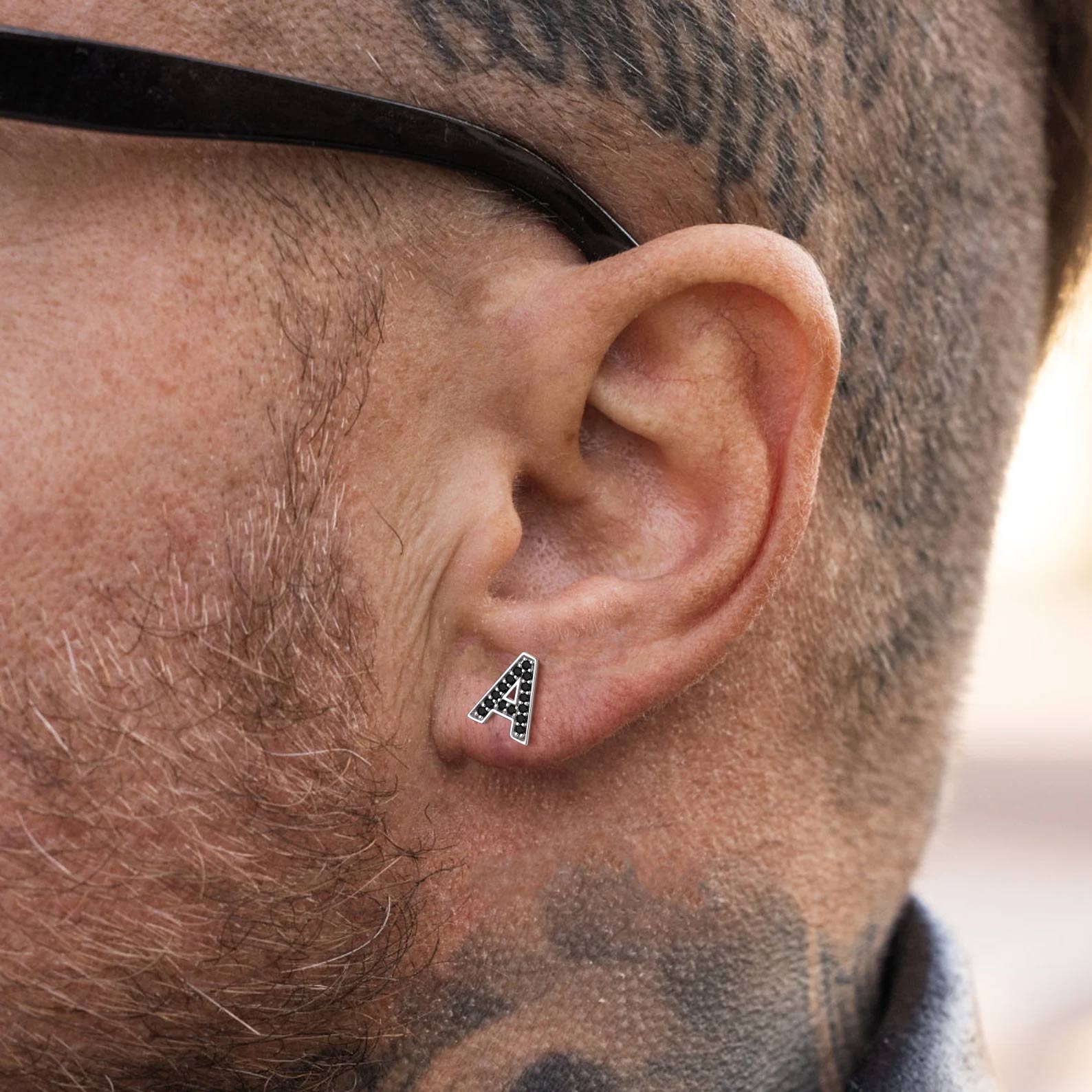 A Man Wearing Sterling_Silver_CZ_Initial_Stud_Earrings